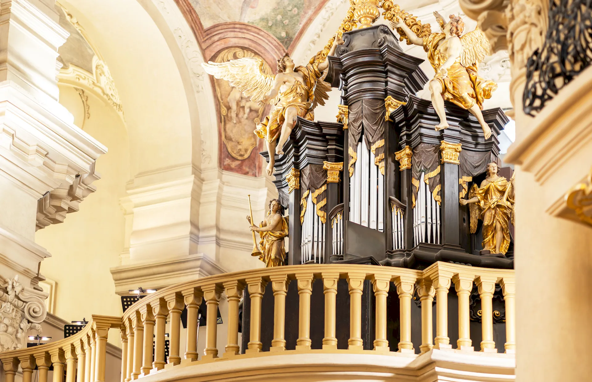 Large pipe organ inside Kostel sv. Mikuláše on the Old Town Square in Prague