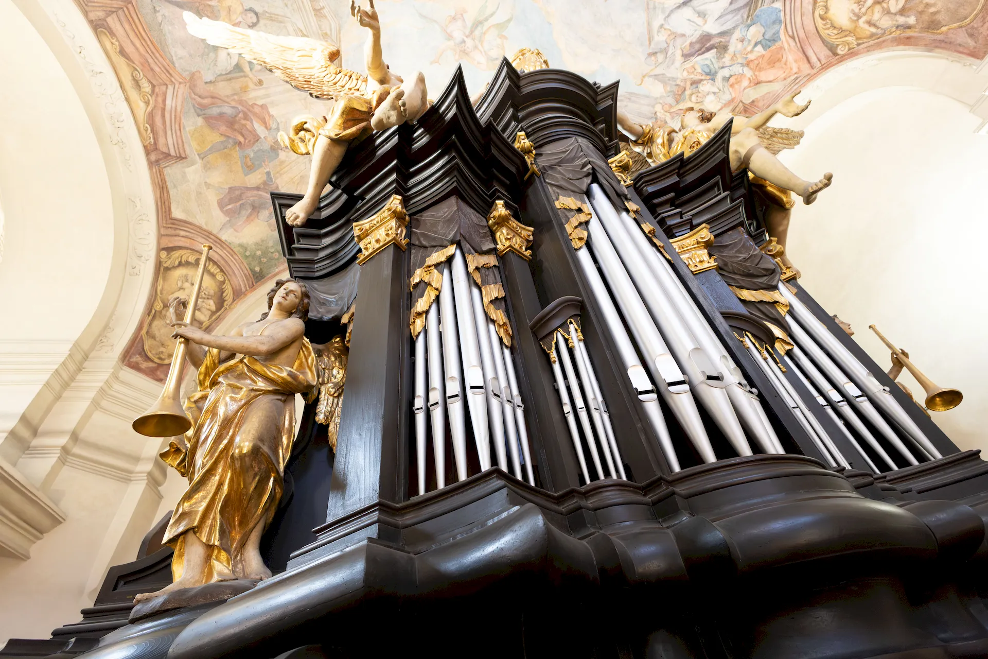 Large pipe organ inside Kostel sv. Mikuláše on the Old Town Square in Prague