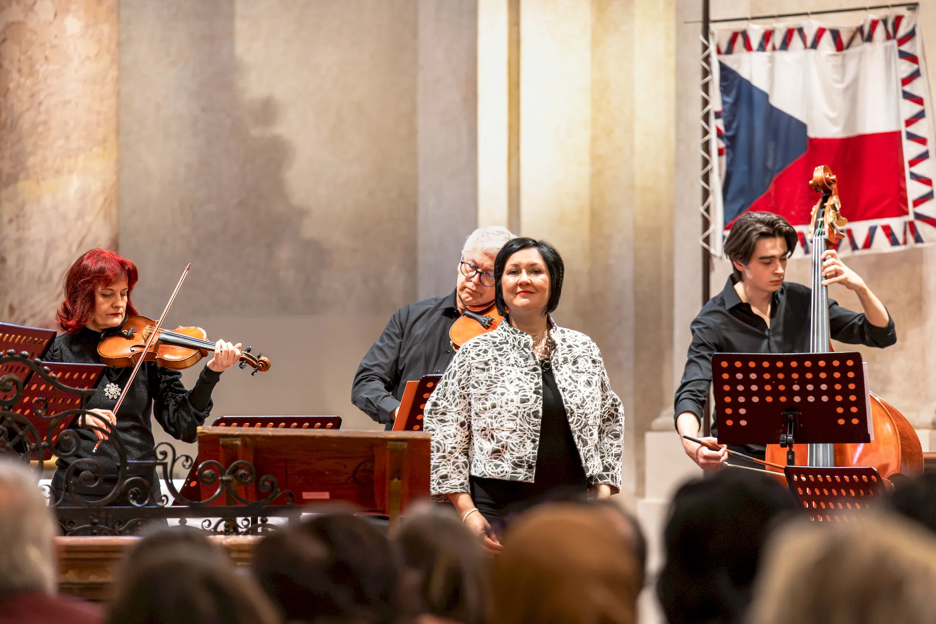 Violinist performing with Prague Concert Orchestra inside Kostel sv. Mikuláše