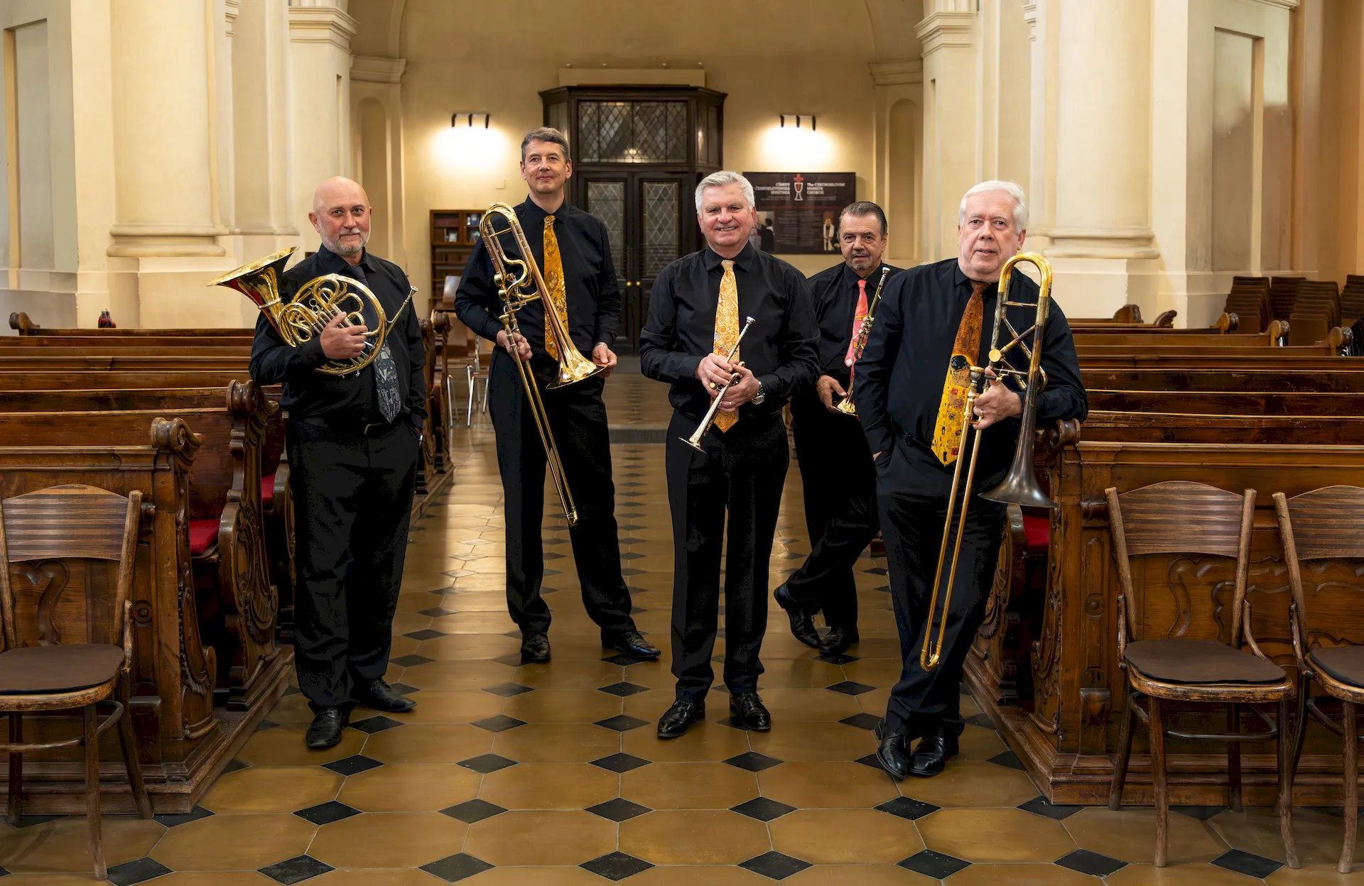 Five musicians of Prague Brass Ensemble inside Kostel sv. Mikuláše in Prague