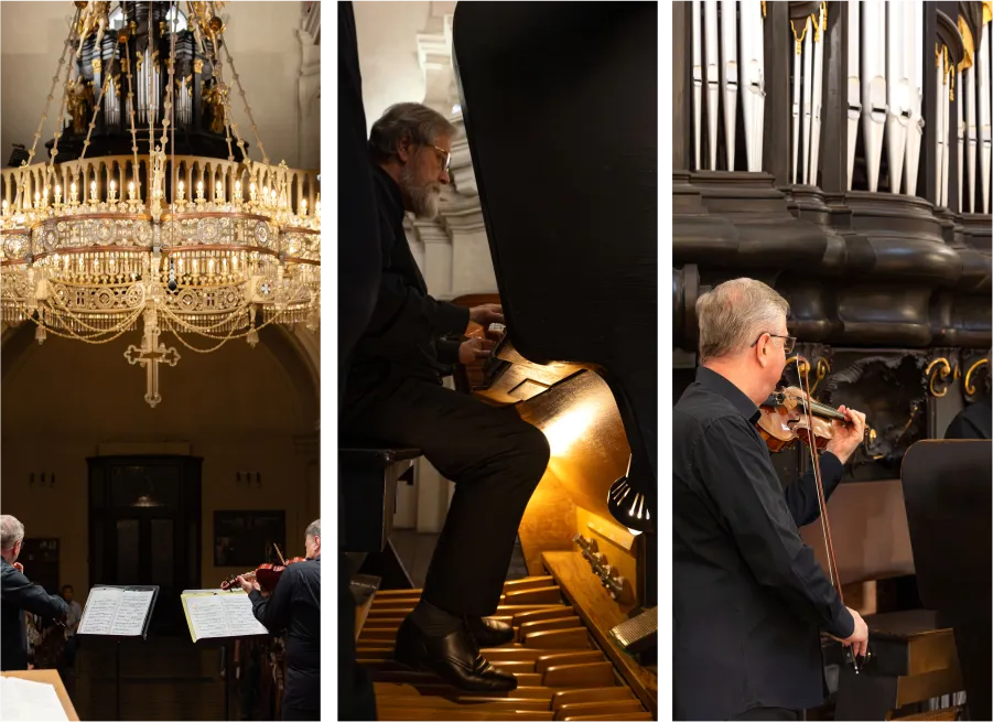 Concert details showing the chandelier, organist and violinist inside Kostel sv. Mikuláše